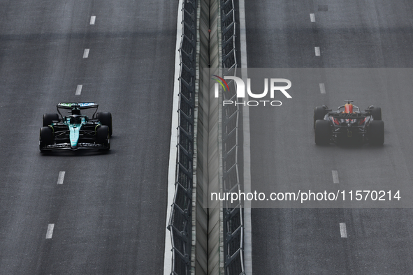 Lance Stroll of Aston Martin Aramco and Max Verstappen of Red Bull Racing during first practice ahead of the Formula 1 Grand Prix of Azerbai...