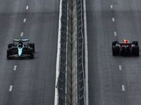 Lance Stroll of Aston Martin Aramco and Max Verstappen of Red Bull Racing during first practice ahead of the Formula 1 Grand Prix of Azerbai...