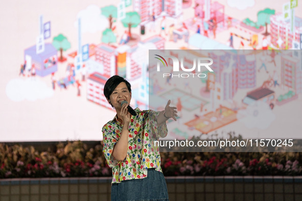 Winnie Ho Wing-yin, Hong Kong Secretary for Housing, speaks at the Well Being Estate Festival at a public housing estate in Hong Kong on Sep...