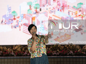 Winnie Ho Wing-yin, Hong Kong Secretary for Housing, speaks at the Well Being Estate Festival at a public housing estate in Hong Kong on Sep...