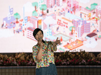 Winnie Ho Wing-yin, Hong Kong Secretary for Housing, speaks at the Well Being Estate Festival at a public housing estate in Hong Kong on Sep...