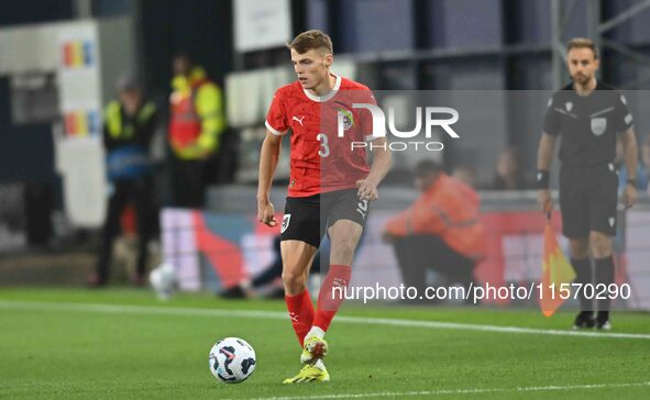 Benjamin Bockle (3 Austria) passes the ball during the International Friendly match between England Under 21s and Austria Under 21s at Kenil...