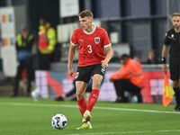 Benjamin Bockle (3 Austria) passes the ball during the International Friendly match between England Under 21s and Austria Under 21s at Kenil...