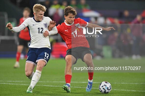 Lewis Hall (12 England) and Simon Seidl (17 Austria) challenge for the ball during the International Friendly match between England Under 21...