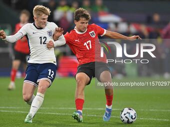 Lewis Hall (12 England) and Simon Seidl (17 Austria) challenge for the ball during the International Friendly match between England Under 21...