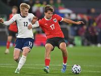 Lewis Hall (12 England) and Simon Seidl (17 Austria) challenge for the ball during the International Friendly match between England Under 21...