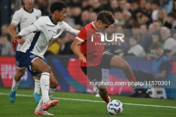 Leon Grgic (15 Austria) challenges Jarrell Quansah (4 England) during the International Friendly match between England Under 21s and Austria...