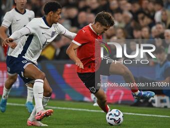 Leon Grgic (15 Austria) challenges Jarrell Quansah (4 England) during the International Friendly match between England Under 21s and Austria...