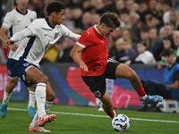 Leon Grgic (15 Austria) challenges Jarrell Quansah (4 England) during the International Friendly match between England Under 21s and Austria...