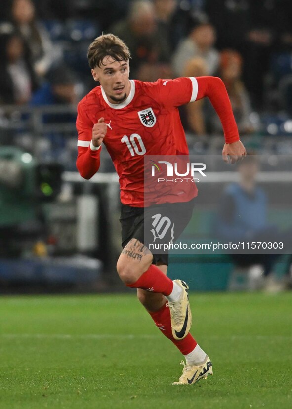 Christoph Lang (10 Austria) goes forward during the International Friendly match between England Under 21s and Austria Under 21s at Kenilwor...