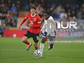 Jamie Bynoe-Gittens (21, England) is challenged by Nikolas Sattlberger (16, Austria) during the International Friendly match between England...