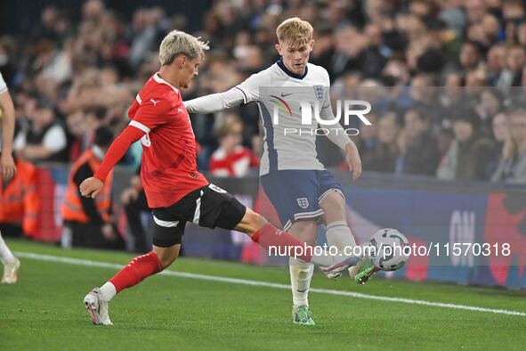 Lewis Hall (12 England) is challenged by Moritz Oswald (13 Austria) during the International Friendly match between England Under 21s and Au...