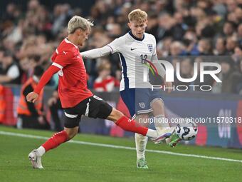 Lewis Hall (12 England) is challenged by Moritz Oswald (13 Austria) during the International Friendly match between England Under 21s and Au...