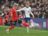 Lewis Hall (12 England) is challenged by Moritz Oswald (13 Austria) during the International Friendly match between England Under 21s and Au...