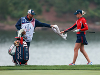 GAINESVILLE, VIRGINIA - SEPTEMBER 13: Nelly Korda of the United States takes a towel from her caddie during Day One of the Solheim Cup at Ro...