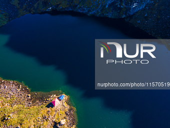 A drone captures an aerial view of Timbung Mountain Lake in Taplejung, Nepal, on September 10, 2024. (