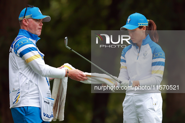 GAINESVILLE, VIRGINIA - SEPTEMBER 13: Albane Valenzuela of Team Europe takes a towel from her caddie at the 9th tee during Day One of the So...