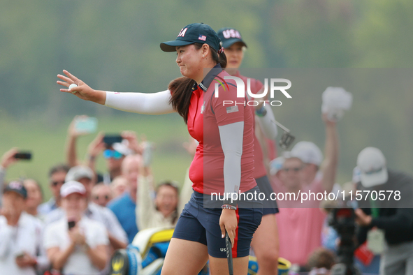 GAINESVILLE, VIRGINIA - SEPTEMBER 13: Allisen Corpuz of the United States acknowledges the gallery at the 16th green during Foursome Matches...