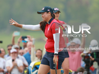 GAINESVILLE, VIRGINIA - SEPTEMBER 13: Allisen Corpuz of the United States acknowledges the gallery at the 16th green during Foursome Matches...