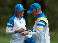 GAINESVILLE, VIRGINIA - SEPTEMBER 13: Albane Valenzuela of Team Europe talks with her caddie on the 9th green during Day One of the Solheim...