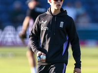 Jacob Bethell of England warms up during the Second Vitality T20 International match between England and Australia at Sofia Gardens in Cardi...