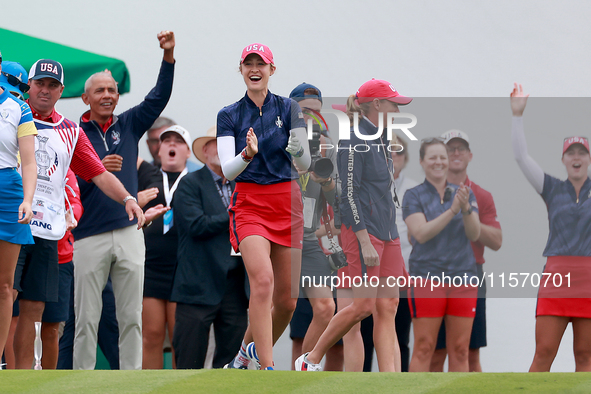 GAINESVILLE, VIRGINIA - SEPTEMBER 13: Nelly Korda of the United States cheers on Team USA next to Captain Stacy Lewis of the United States a...