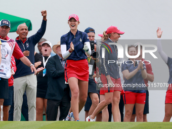 GAINESVILLE, VIRGINIA - SEPTEMBER 13: Nelly Korda of the United States cheers on Team USA next to Captain Stacy Lewis of the United States a...