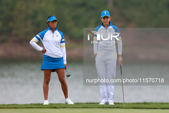 GAINESVILLE, VIRGINIA - SEPTEMBER 13: Celine Boutier of Team Europe waits with Albane Valenzuela of Team Europe  on the 9th green during Day...