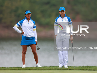 GAINESVILLE, VIRGINIA - SEPTEMBER 13: Celine Boutier of Team Europe waits with Albane Valenzuela of Team Europe  on the 9th green during Day...