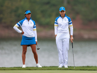 GAINESVILLE, VIRGINIA - SEPTEMBER 13: Celine Boutier of Team Europe waits with Albane Valenzuela of Team Europe  on the 9th green during Day...