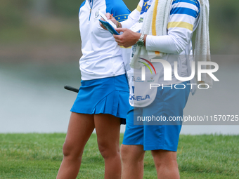 GAINESVILLE, VIRGINIA - SEPTEMBER 13: Celine Boutier of Team Europe waits with her caddie on the 9th green during Day One of the Solheim Cup...