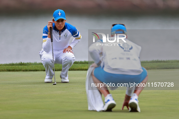 GAINESVILLE, VIRGINIA - SEPTEMBER 13: Albane Valenzuela of Team Europe lines up her putt on the 9th green during Day One of the Solheim Cup...