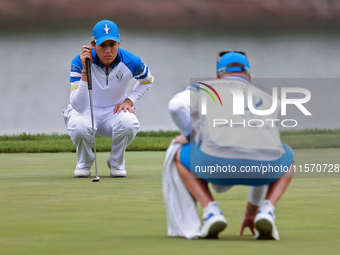 GAINESVILLE, VIRGINIA - SEPTEMBER 13: Albane Valenzuela of Team Europe lines up her putt on the 9th green during Day One of the Solheim Cup...