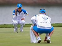 GAINESVILLE, VIRGINIA - SEPTEMBER 13: Albane Valenzuela of Team Europe lines up her putt on the 9th green during Day One of the Solheim Cup...