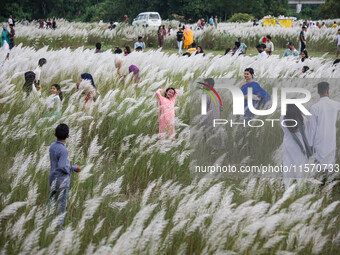 People Visit A Kans Grass Flower Field On The Afternoon Of The Weekend, At The Sarighat Area In Dhaka, Bangladesh, On Friday, September 13,...