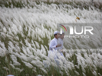 People Visit A Kans Grass Flower Field On The Afternoon Of The Weekend, At The Sarighat Area In Dhaka, Bangladesh, On Friday, September 13,...