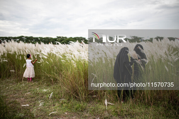 People Visit A Kans Grass Flower Field On The Afternoon Of The Weekend, At The Sarighat Area In Dhaka, Bangladesh, On Friday, September 13,...