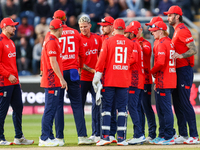 #92, Brydon Carse of England (center - facing camera) celebrates the opening wicket with teammates during the Second Vitality T20 Internatio...