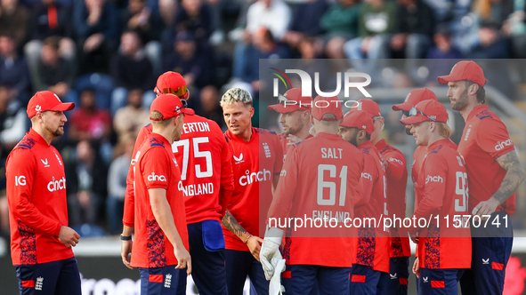 #92, Brydon Carse of England (center - facing camera) celebrates the opening wicket with teammates during the Second Vitality T20 Internatio...