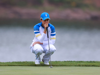 GAINESVILLE, VIRGINIA - SEPTEMBER 13: Albane Valenzuela of Team Europe lines up her putt on the 9th green during Day One of the Solheim Cup...