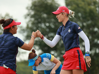 GAINESVILLE, VIRGINIA - SEPTEMBER 13: Nelly Korda of the United States (R) celebrates with her teammate Megan Khang (L) after her putt on th...