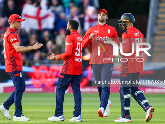 Adil Rashid of England is congratulated for his dismissal of Matthew Short of Australia during the Second Vitality T20 International match b...