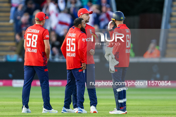 Adil Rashid of England is congratulated for his dismissal of Matthew Short of Australia during the Second Vitality T20 International match b...