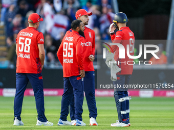 Adil Rashid of England is congratulated for his dismissal of Matthew Short of Australia during the Second Vitality T20 International match b...