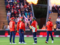 Adil Rashid of England is congratulated for his dismissal of Matthew Short of Australia during the Second Vitality T20 International match b...