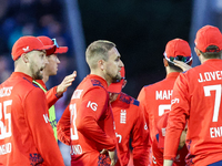 #23, Liam Livingstone of England (center facing right), celebrates taking the wicket of #17, Marcus Stones of Australia, caught by #75, Jami...