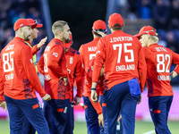 #23, Liam Livingstone of England (center facing right), celebrates taking the wicket of #17, Marcus Stones of Australia, caught by #75, Jami...