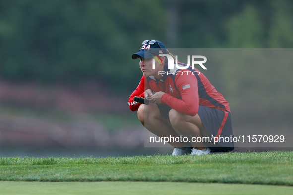 GAINESVILLE, VIRGINIA - SEPTEMBER 13: Jennifer Kupcho of the United States lines up her putt on the 9th green during Day One of the Solheim...