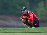 GAINESVILLE, VIRGINIA - SEPTEMBER 13: Jennifer Kupcho of the United States lines up her putt on the 9th green during Day One of the Solheim...