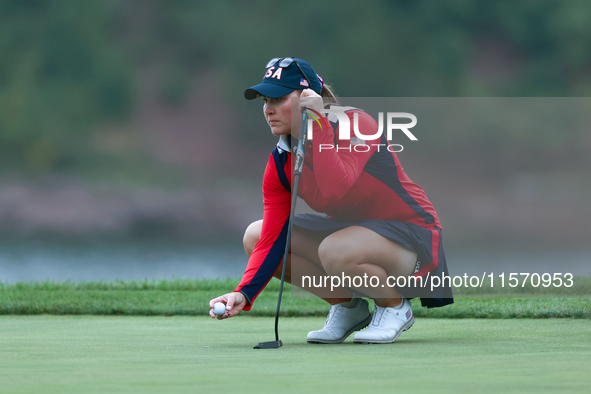 GAINESVILLE, VIRGINIA - SEPTEMBER 13: Jennifer Kupcho of the United States lines up her putt on the 9th green during Day One of the Solheim...